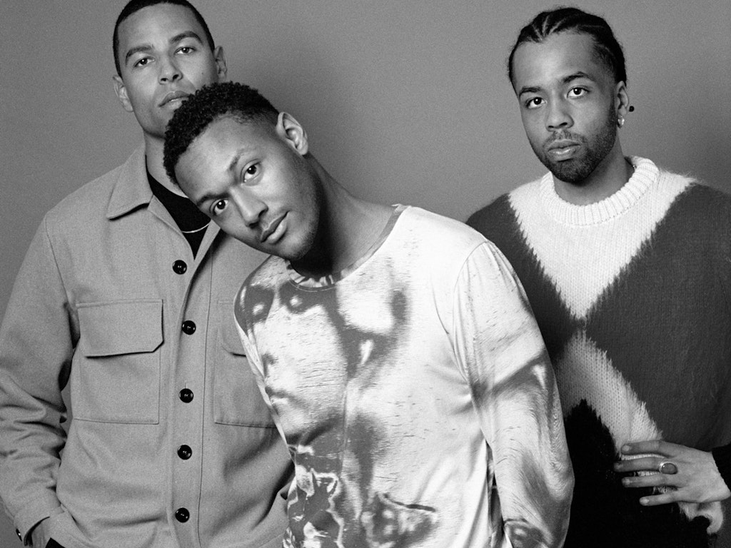 Black and white shot of the three members of Somatic Rituals looking directly at the camera.